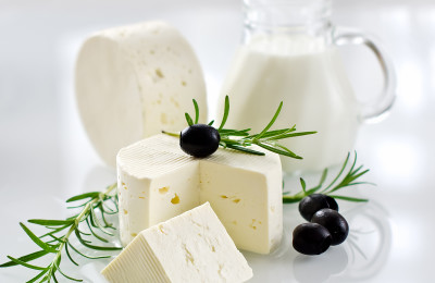 Healthy soft paneer cheese with rosemary and black olives
