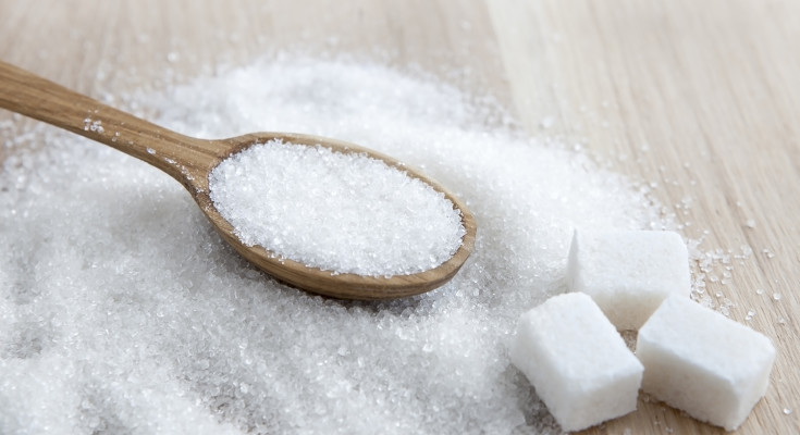 Sugar on wooden table. Selective focus